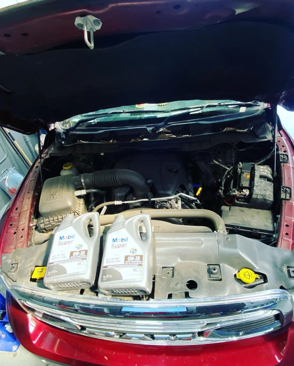 Open engine bay of a vehicle in the workshop